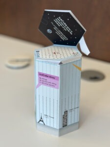 paper foldable designed by Dennis Soldin demonstrating the scale of the ICECUBE detector apparatus